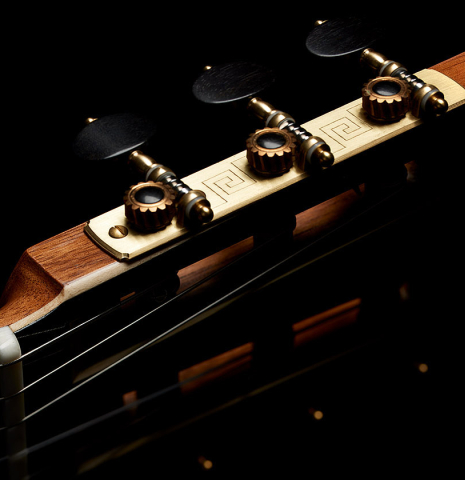 The tuning machines of a 2024 Marc Dickinson “Cosmic” classical guitar made of cedar and Indian rosewood
