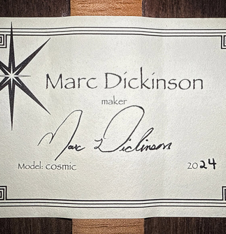 The label of a 2024 Marc Dickinson “Cosmic” classical guitar made of cedar and Indian rosewood