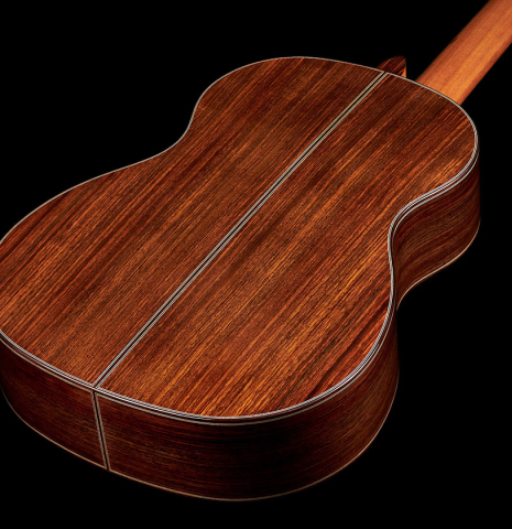 The back and sides at the foot of a 2023 Marc Dickinson "Cosmic" classical guitar made of spruce and Indian rosewood