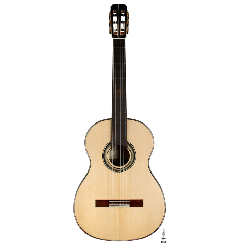 The front of a 2023 Marc Dickinson "Cosmic" classical guitar made of spruce and Indian rosewood
