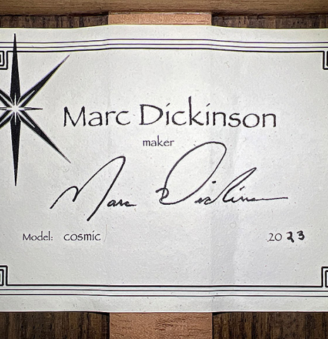 The label of a 2023 Marc Dickinson "Cosmic" classical guitar made of spruce and Indian rosewood
