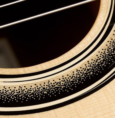 Detail of the rosette of a 2023 Marc Dickinson "Cosmic" classical guitar made of spruce and Indian rosewood