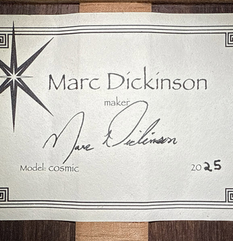 The label of a 2025 Marc Dickinson "Cosmic" classical guitar made of spruce and Indian rosewood