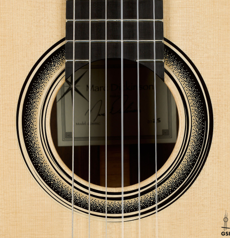 The rosette of a 2025 Marc Dickinson "Cosmic" classical guitar made of spruce and Indian rosewood