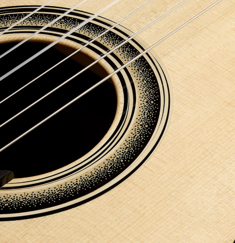 Close-up of the rosette of a 2025 Marc Dickinson "Cosmic" classical guitar made of spruce and Indian rosewood