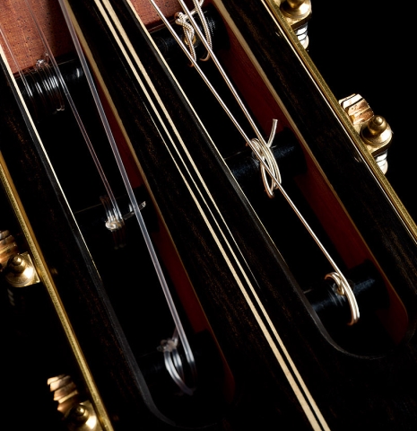The headstock and tuning machines of a 2026 Marc Dickinson "Cosmic" classical guitar made of spruce and African blackwood