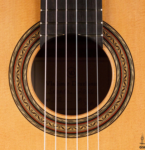 The rosette of a 2020 Vladimir Druzhinin classical guitar made of cedar and African rosewood