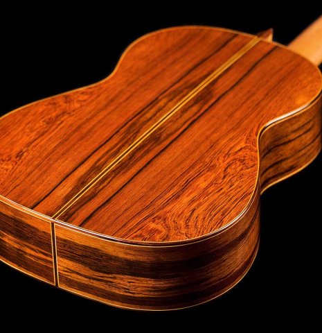 The back and sides of a 2020 Vladimir Druzhinin classical guitar made of cedar and African rosewood