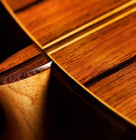 The heel, back binding and purflings of a 2020 Vladimir Druzhinin classical guitar made of cedar and African rosewood