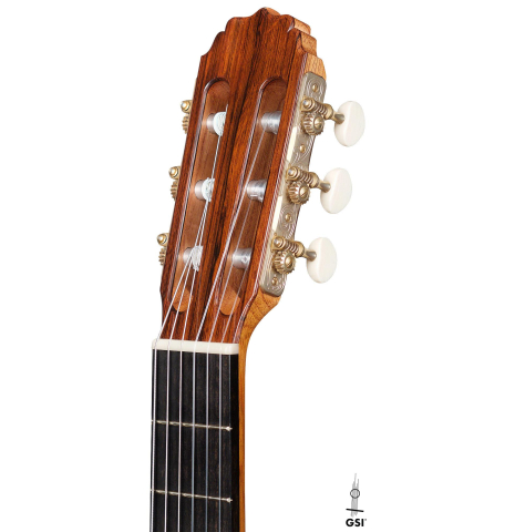 The headstock of a 2020 Vladimir Druzhinin classical guitar made of cedar and African rosewood. The headstock of a 2020 Vladimir Druzhinin classical guitar made of cedar and African rosewood.