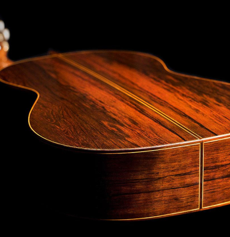 The lower bout of a 2020 Vladimir Druzhinin classical guitar made of cedar and African rosewood. The lower bout of a 2020 Vladimir Druzhinin classical guitar made of cedar and African rosewood.