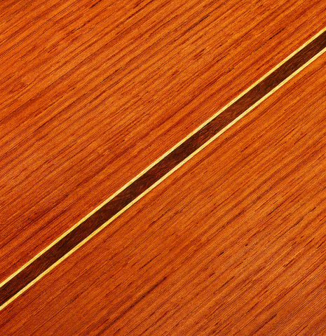 Closeup of the back center seam of a 2024 Vladimir Druzhinin classical guitar made with cedar and African rosewood.