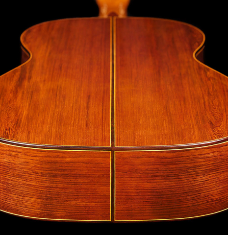 The back and sides at the foot of a 2024 Vladimir Druzhinin classical guitar made with cedar and African rosewood.