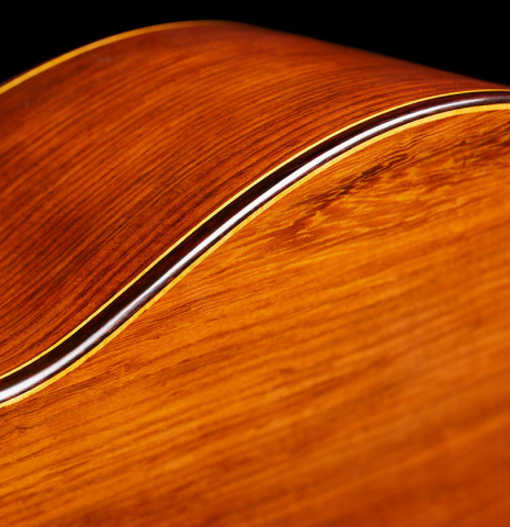 The back, side, binding and purflings of a 2024 Vladimir Druzhinin classical guitar made with cedar and African rosewood.