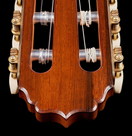 The headstock and tuning machines of a 2024 Vladimir Druzhinin classical guitar made with cedar and African rosewood.