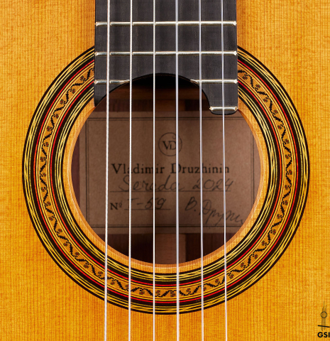 The rosette of a 2024 Vladimir Druzhinin classical guitar made with cedar and African rosewood.