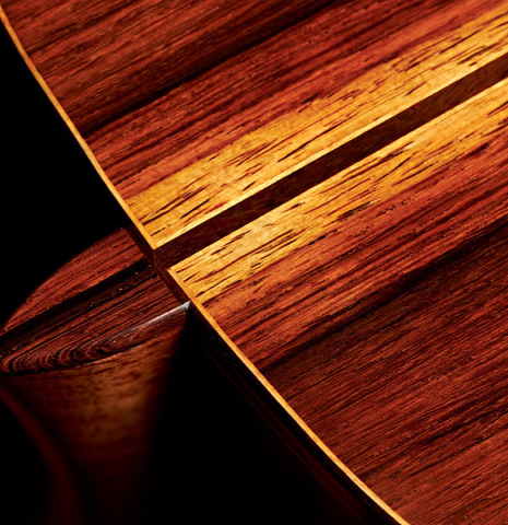 The heel of a 2023 Vladimir Druzhinin classical guitar made with spruce and African rosewood.