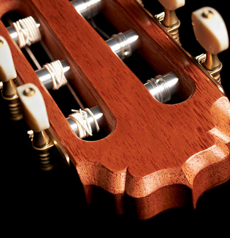 The headstock of a 2023 Vladimir Druzhinin classical guitar made with spruce and African rosewood.