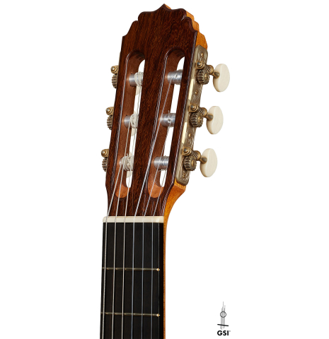 The headstock of a 2025 Vladimir Druzhinin classical guitar made of spruce and African rosewood