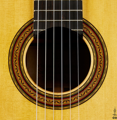 The rosette of a 2025 Vladimir Druzhinin classical guitar made of spruce and African rosewood