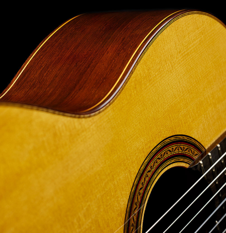 The soundboard and side of a 2025 Vladimir Druzhinin classical guitar made of spruce and African rosewood