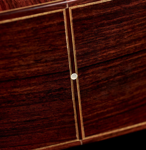 The lower bout of a 1994 Jeffrey Elliott classical guitar made with spruce and Indian rosewood.