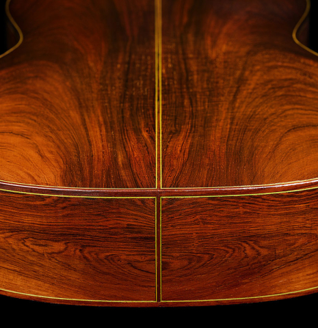 The back and sides at the foot of a 1981 Jeffrey Elliott classical guitar made of spruce and CSA rosewood