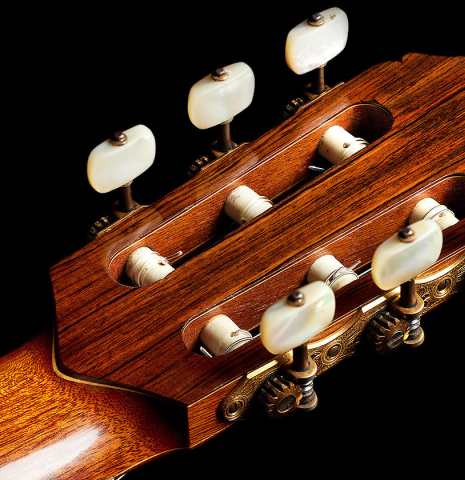 The back headstock veneer of a 1981 Jeffrey Elliott classical guitar made of spruce and CSA rosewood