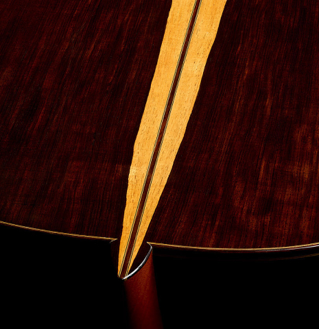 The heel and back center seam of a 1990 Jeffrey Elliott classical guitar made of spruce and African blackwood