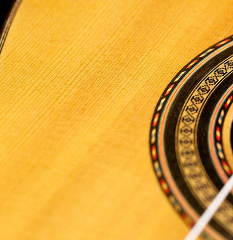 The soundboard and rosette detail of a 1932 Domingo Esteso classical guitar made of spruce and CSA rosewood