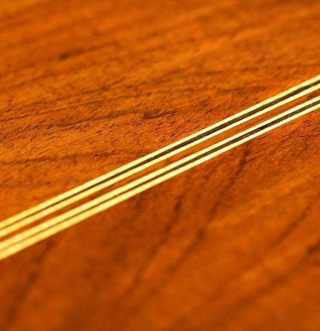 The back center seam of a 1932 Domingo Esteso classical guitar made of spruce and CSA rosewood