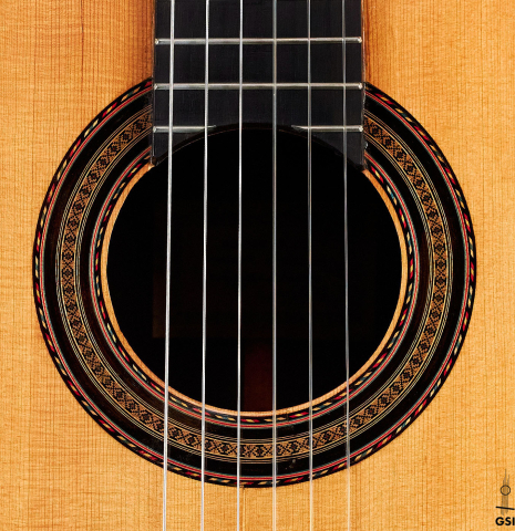 The rosette of a 1933 Domingo Esteso classical guitar made with spruce and CSA rosewood