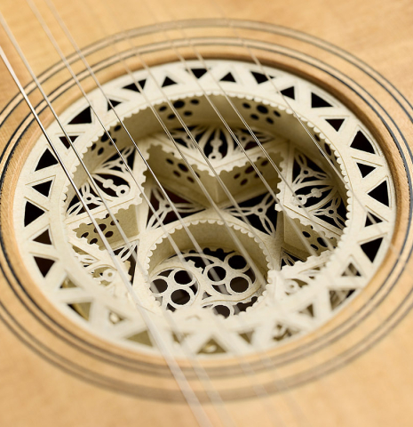 The 3-dimensional "rose" in the soundhole of a 2007 Lucian Faria "Baroque Guitar" made of spruce and CSA rosewood
