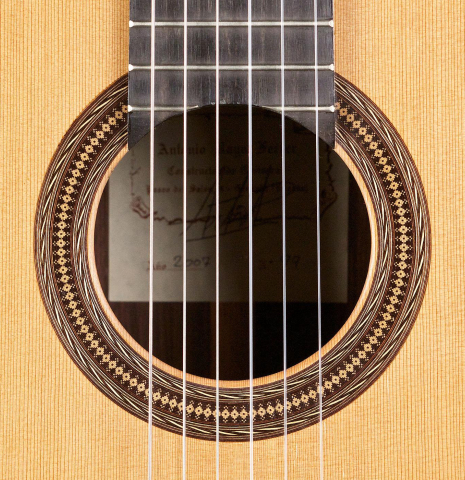 The rosette of a 2007 Antonio Raya Ferrer classical guitar made of cedar and Indian rosewood