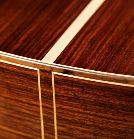 The back and central strip of a 2007 Antonio Raya Ferrer classical guitar made of cedar and Indian rosewood