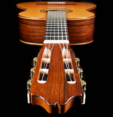 The headstock of a 2007 Antonio Raya Ferrer classical guitar made of cedar and Indian rosewood
