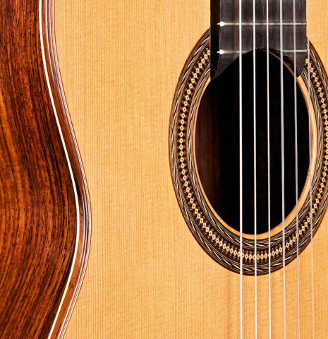 The soundboard and side of a 2007 Antonio Raya Ferrer classical guitar made of cedar and Indian rosewood