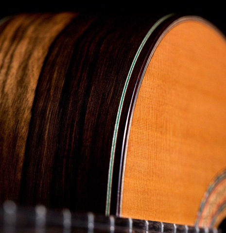 This is the side and binding of a 2020 Gerundino Fernandez Hijo &quot;Negra&quot; flamenco guitar made with exotic ebony and cedar.