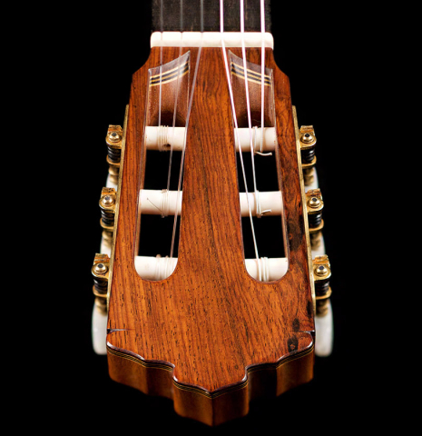 The headstock of a 2022 Juan Garcia Fernandez classical guitar made with spruce top and cocobolo back and sides