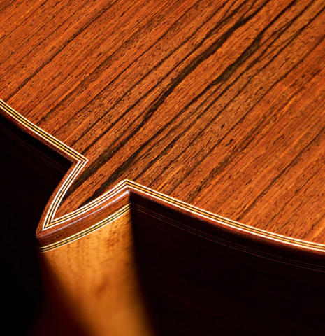 The heel of a 2022 Juan Garcia Fernandez classical guitar made with spruce top and cocobolo back and sides