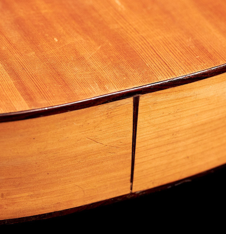 The back and binding of a 1891 Benito Ferrer historical classical guitar