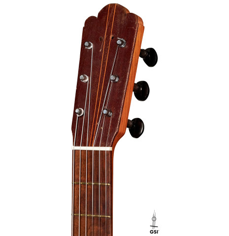 The headstock and traditional pegs of a 1891 Benito Ferrer historical classical guitar
