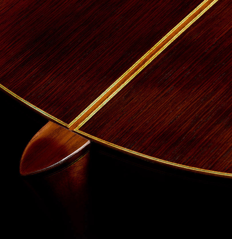 The heel, back binding and purfling of a 1966 Arcangel Fernandez classical guitar made of spruce and CSA rosewood