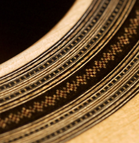 The rosette of a 2022 Dominique Field classical guitar made with spruce and CSA rosewood