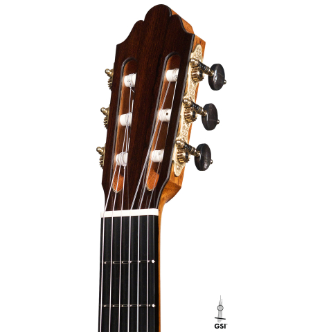 The headstock of a 2022 Dominique Field classical guitar made with spruce and CSA rosewood