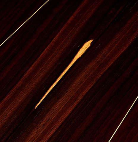 Detail of the back center seam of a 2023 Dominique Field classical guitar made with spruce and CSA rosewood