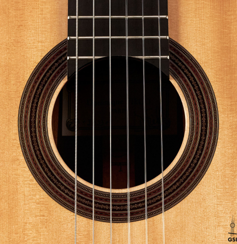 The rosette of a 2023 Dominique Field classical guitar made with spruce and CSA rosewood