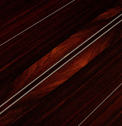 The back center seam of a 2025 Dominique Field classical guitar made of spruce and CSA rosewood
