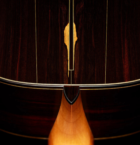 The heel, back binding and purfling of a 2025 Dominique Field classical guitar made of spruce and CSA rosewood