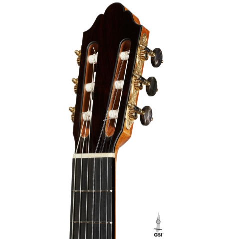 The headstock of a 2025 Dominique Field classical guitar made of spruce and CSA rosewood
